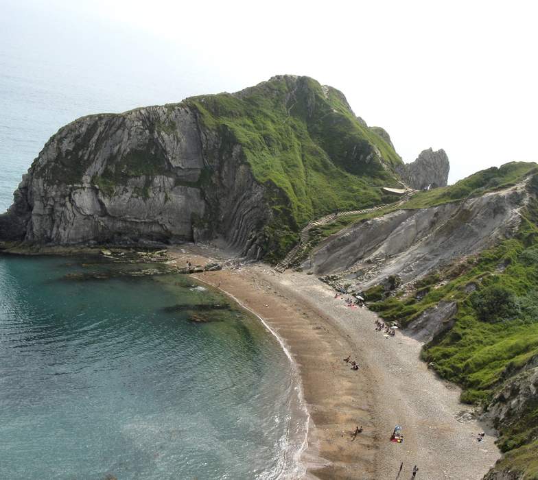 Beach: Area of loose particles at the edge of the sea or other body of water