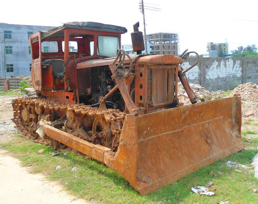 Bulldozer: Mobile machine which uses a frontal blade to push large volumes of material