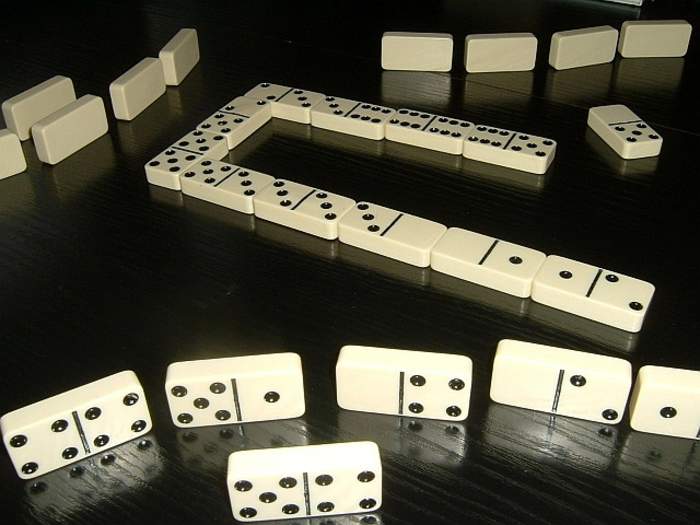 Dominoes: Chinese and European game played with rectangular tiles