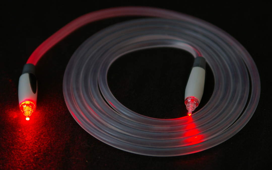 Fiber-optic cable: Cable assembly containing one or more optical fibers that are used to carry light