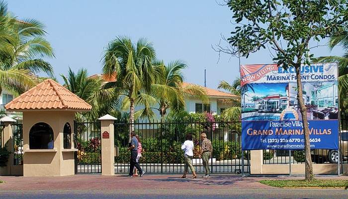 Gated community: Residential community with controlled entrances and often a closed perimeter of walls/fences