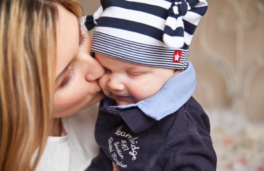 Kiss: Touch with the lips, usually to express love, affection or greeting