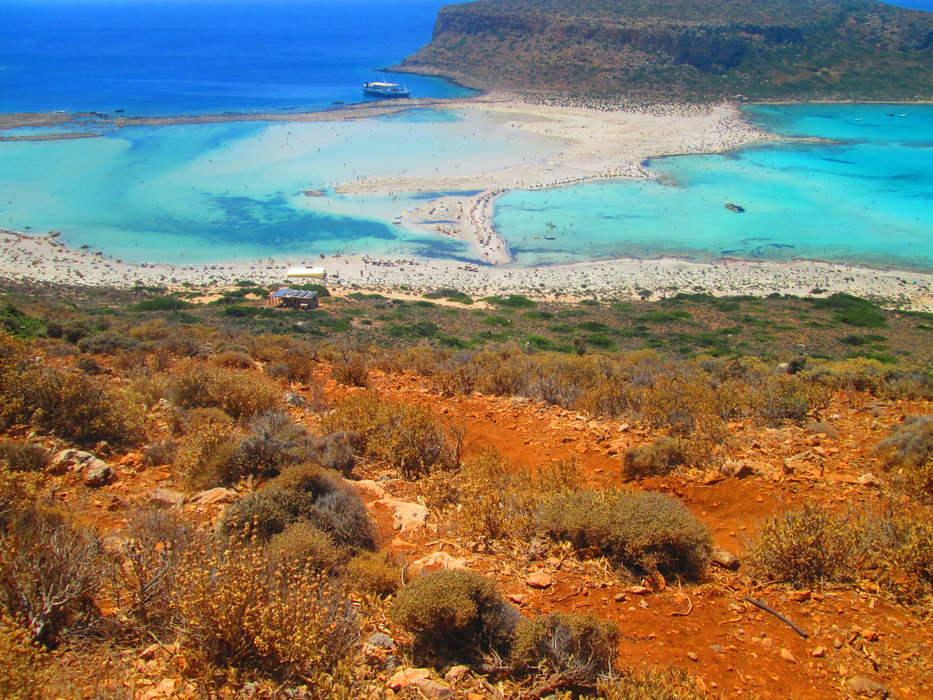 Lagoon: Shallow body of water separated from a larger one by a narrow landform