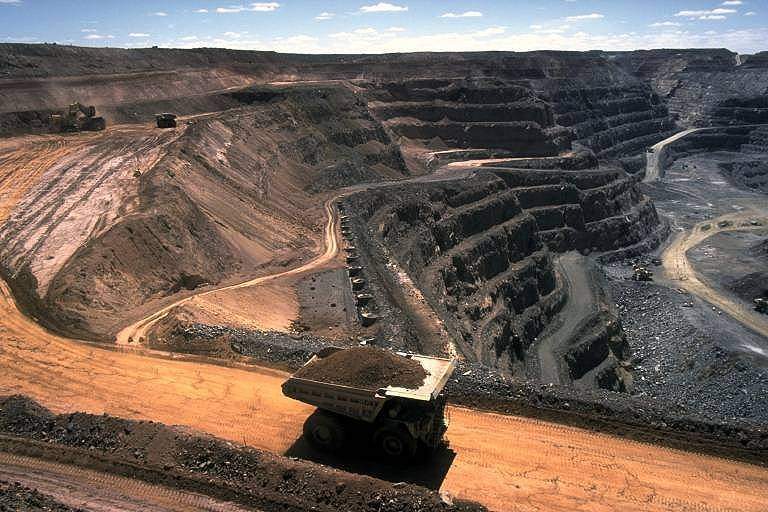 Mining: Extraction of valuable minerals or other geological materials from the Earth