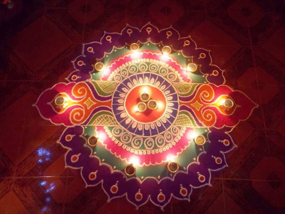 Rangoli: Traditional art form of India, in which coloured patterns are created on the ground