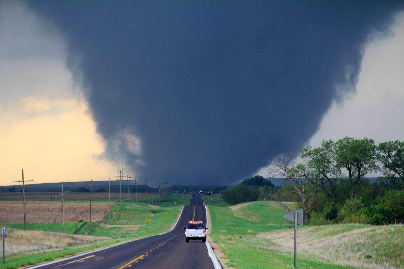 Tornado: Violently rotating column of air in contact with both the Earth's surface and a cumulonimbus cloud