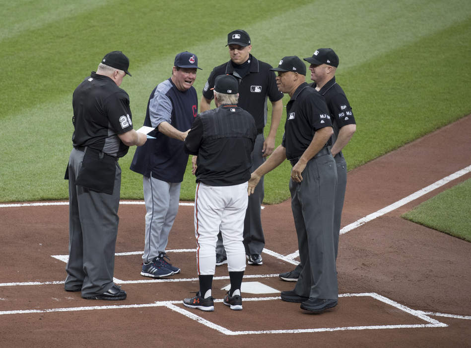 Umpire (baseball): Person charged with officiating a baseball game