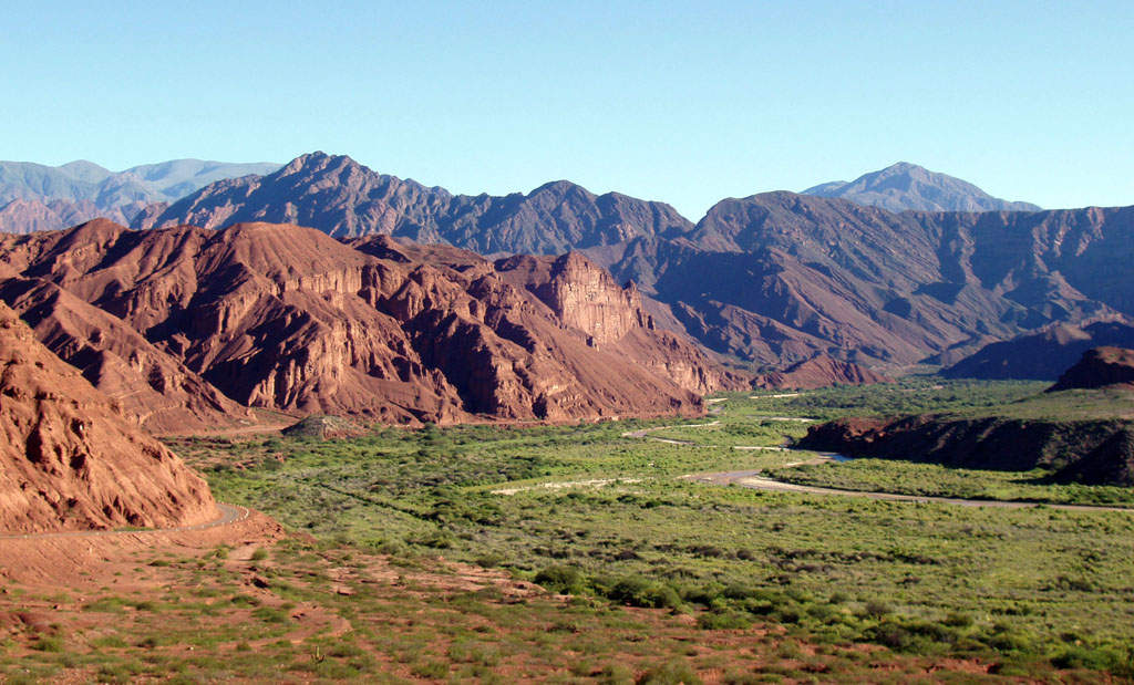 Valley: Low area between hills, often with a river running through it